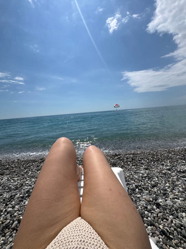 Lazy summer afternoon on Gagra's pebble beach, Black Sea