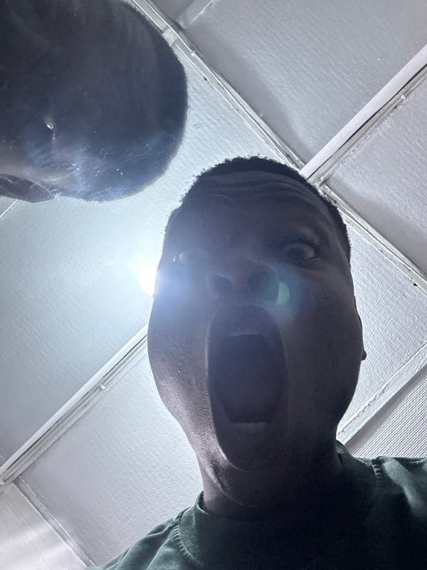 Young men socialize, game on phones in Ikorodu gathering