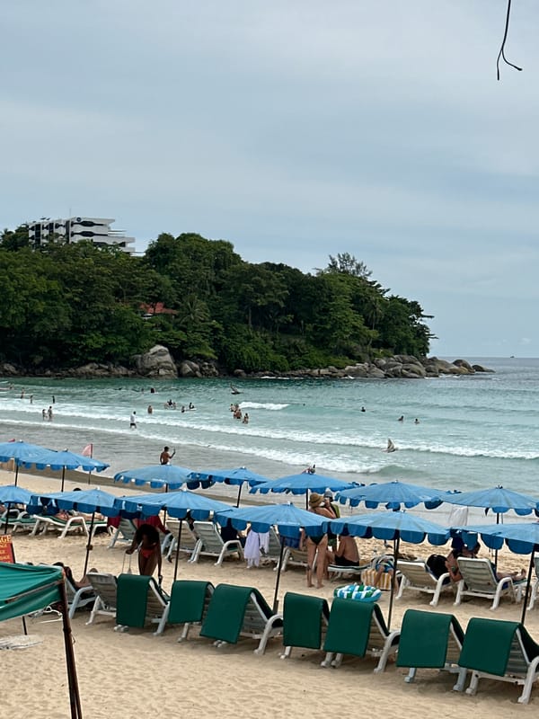 Quiet morning at Karon Beach, chairs and umbrellas ready