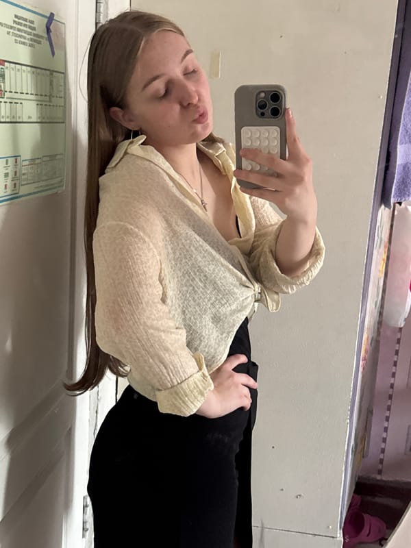 Woman takes mirror selfies in Perm apartment room