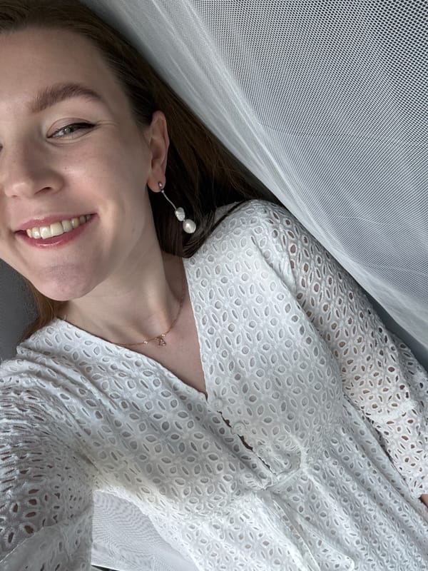 Smiling portrait in a white eyelet dress, Izhevsk
