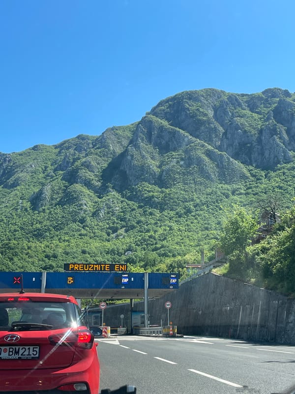 Red car at Montenegro mountain highway toll booth