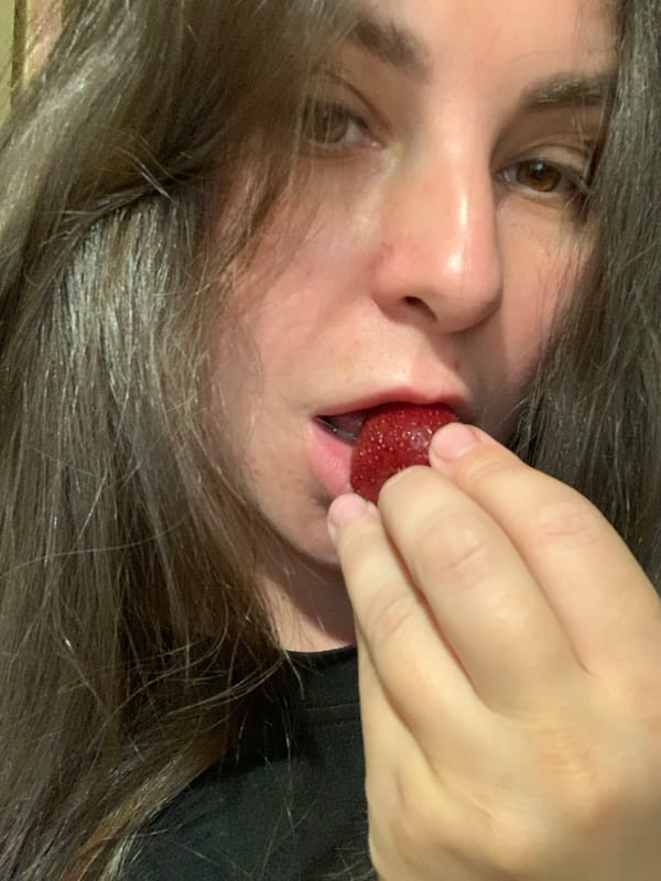 Close-up moments with fresh strawberries, eating and holding