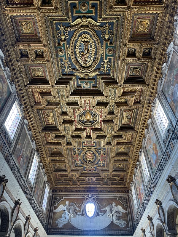 Tourist documents ornate Roman interiors and Campidoglio plaza