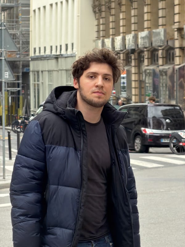Ordinary afternoon street life documented across central Paris