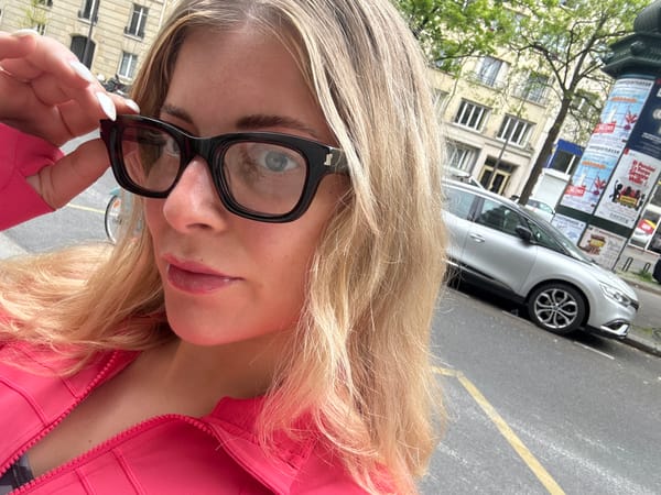 Woman Takes Selfie on Paris Street