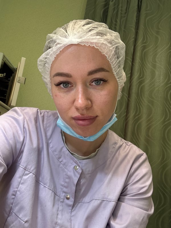 Medical worker in surgical attire observed during procedure in Russia