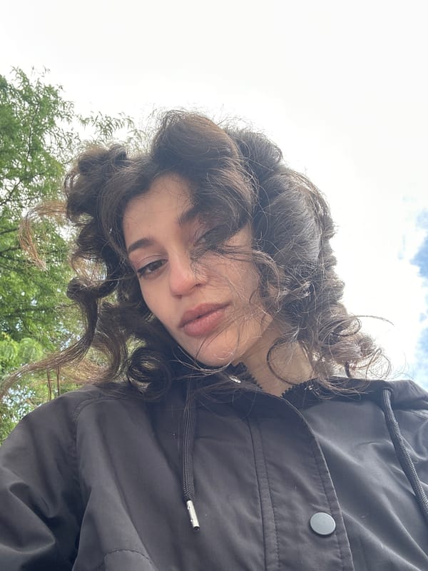 Woman takes selfies at Sofia playground during windy afternoon