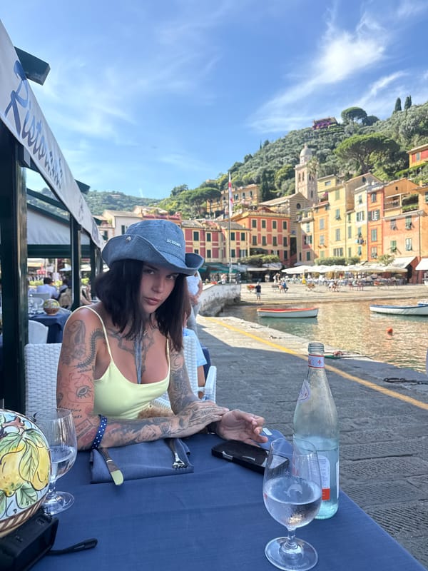 Lunch at a Portofino terrace, Jacquemus hat in frame