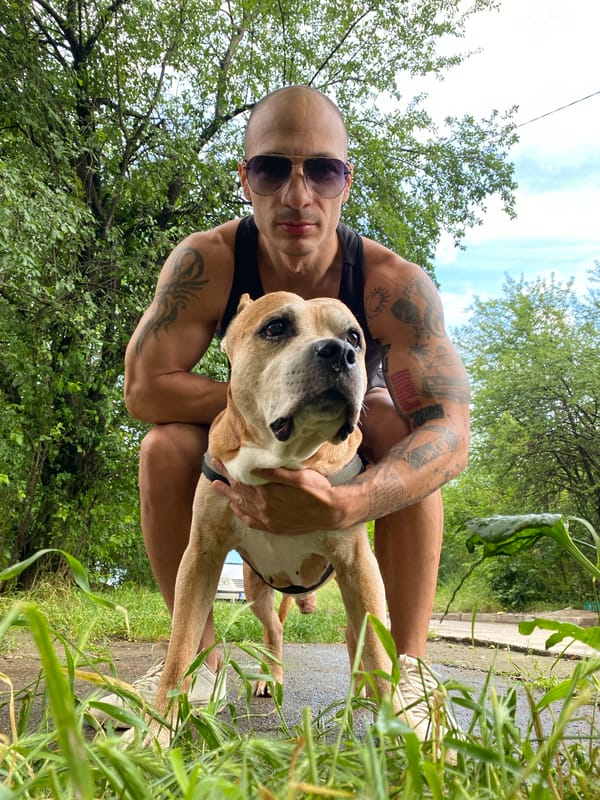 Man and dog photographed outdoors in Pleven, Bulgaria