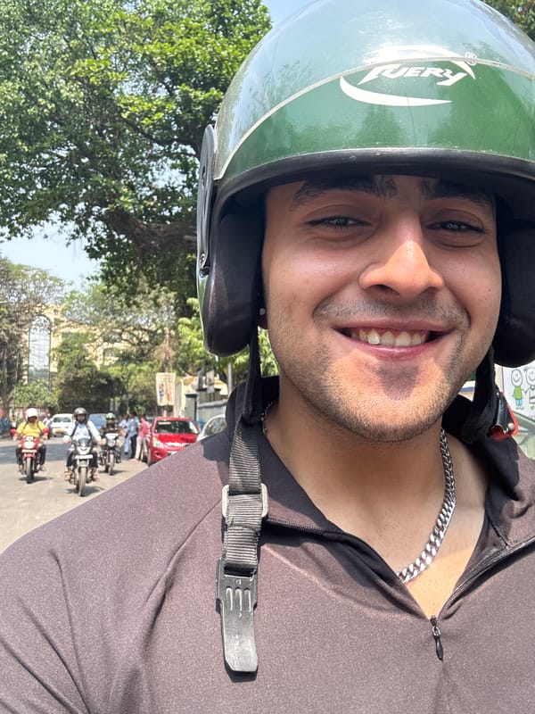 Motorcyclist takes selfies while riding through Kolkata streets