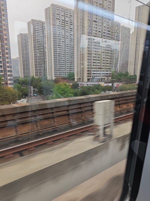 Train passenger observes residential towers in Chongqing High-tech Zone