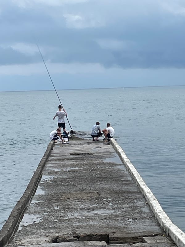 Quiet morning on a Sochi pier — fishing and waterfront downtime.