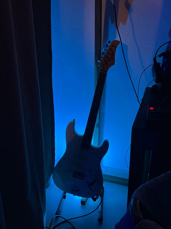 Home music studio with guitar, equipment documented in Goviyapana