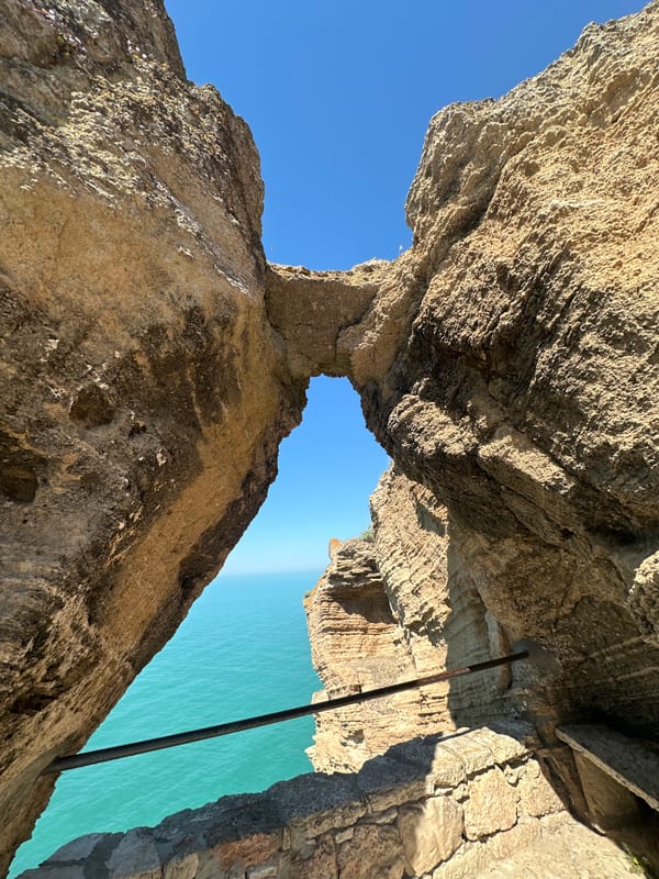 Tourist captures scenic view through Cape Kaliakra rock formation