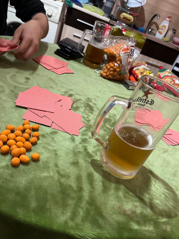 Casual gathering with beer and peanuts documented in Smolyan