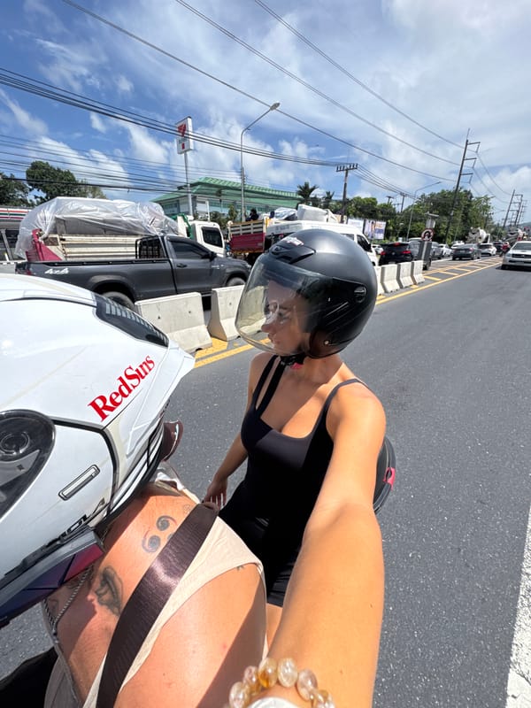 Woman on motorcycle observed in morning traffic in Wichit, Thailand