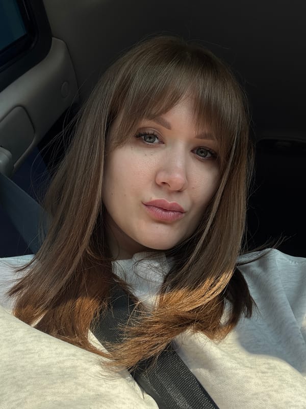 Woman takes selfie in vehicle in Alnashi, Russia
