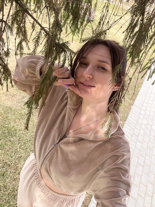 Woman visits park in Kargapolye, Russia on spring morning