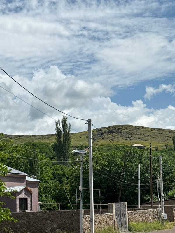 Rural landscape with stone wall and gate documented
