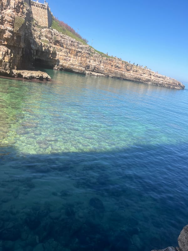 Visitor documents sunny morning scenes in Polignano a Mare