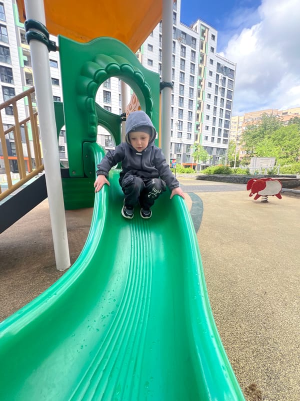Child plays with soccer ball in Mytishchi playground