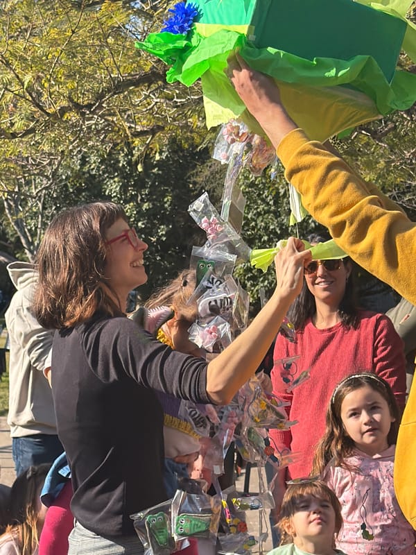 Children celebrate Lila's dinosaur-themed birthday party in Melchor Romero
