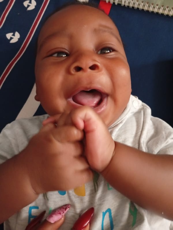 Mother takes selfie with baby in Sabon Tasha home