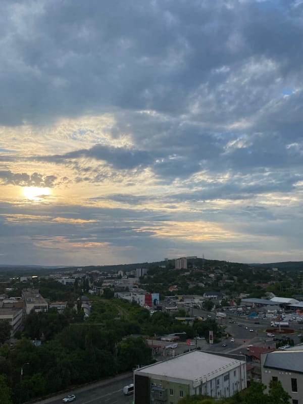 Chișinău from above, dramatic skies and green city canopy