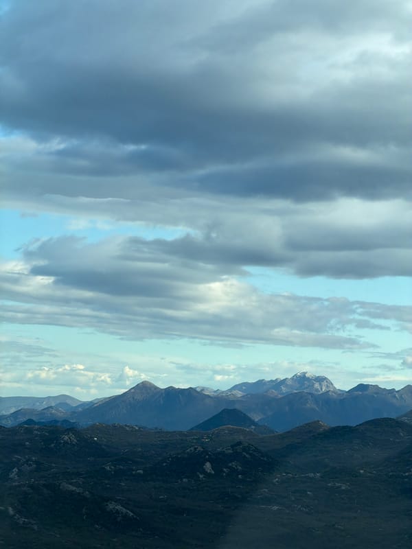 Traveler captures Montenegro mountain vista from roadside vehicle