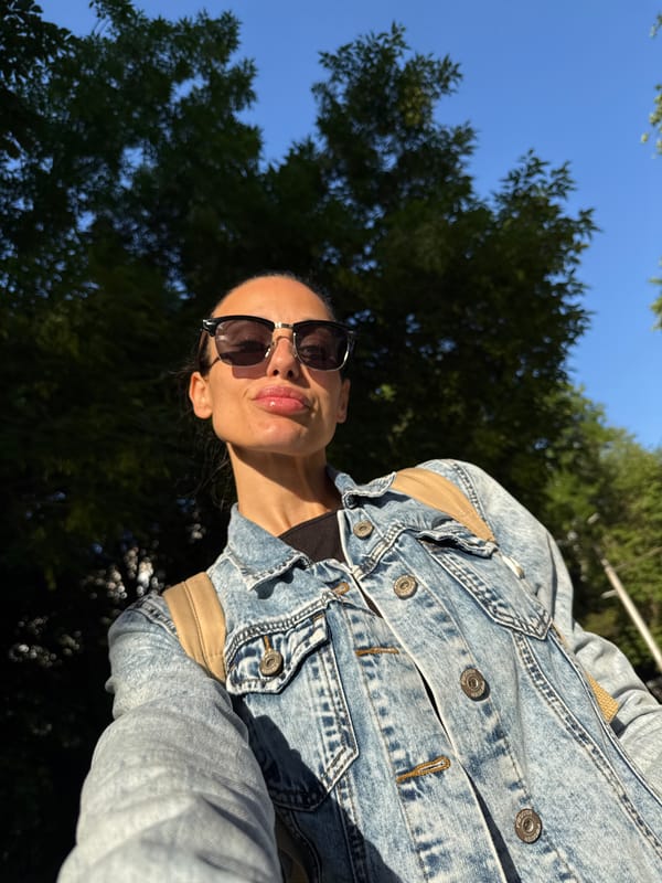 Woman takes early morning selfie on Pleven sidewalk