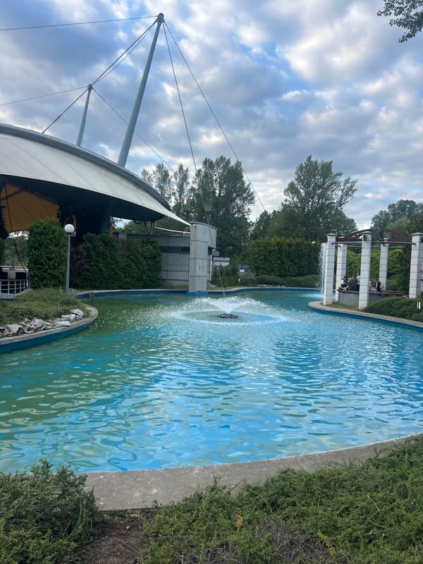 Turquoise fountain pool on a cloudy afternoon in Warsaw