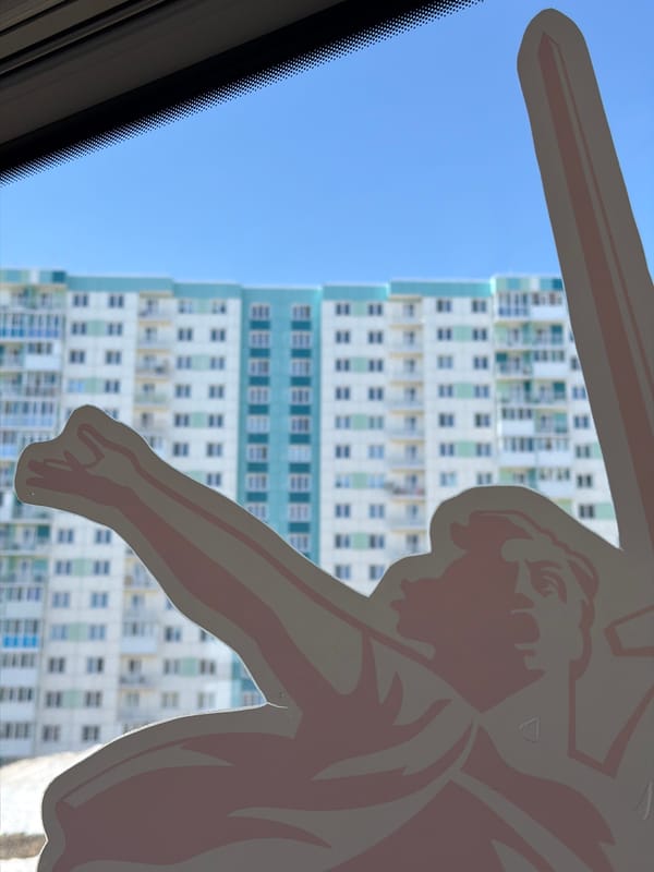 Vehicle passengers document urban Berezniki street views