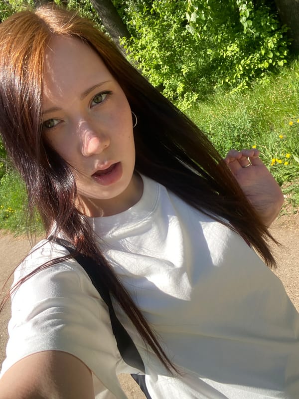 Woman photographed during outdoor photo session in park setting