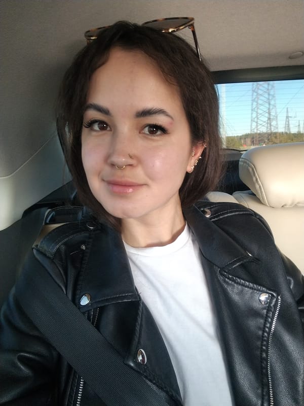 Woman takes car selfie in Noviy, Russia