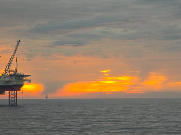 Sunset observed over North Sea oil rigs