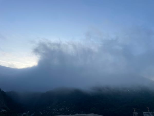 Early morning fog blankets mountain valley in Baranovka, Russia