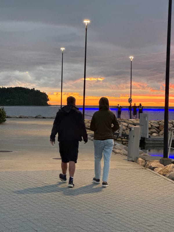 Tallinn waterfront promenade at a striking midsummer sunset