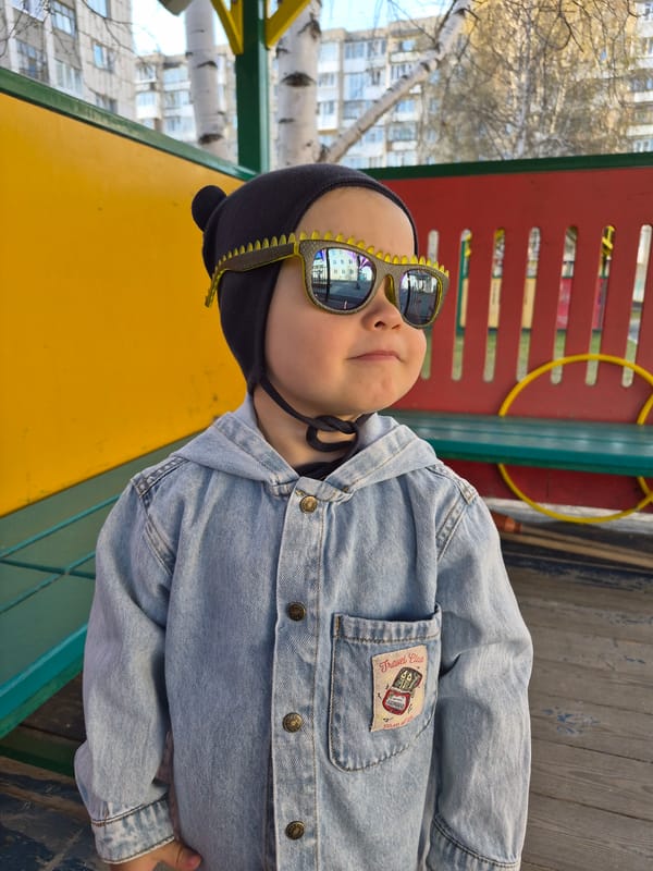 Children play with toy vehicles in Tobolsk playground