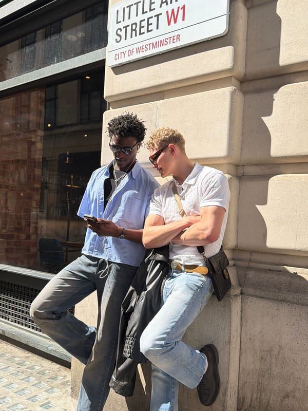 Two young men photographed outside London building