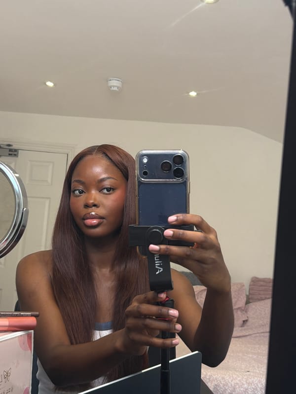 Woman takes mirror selfie indoors in Bristol