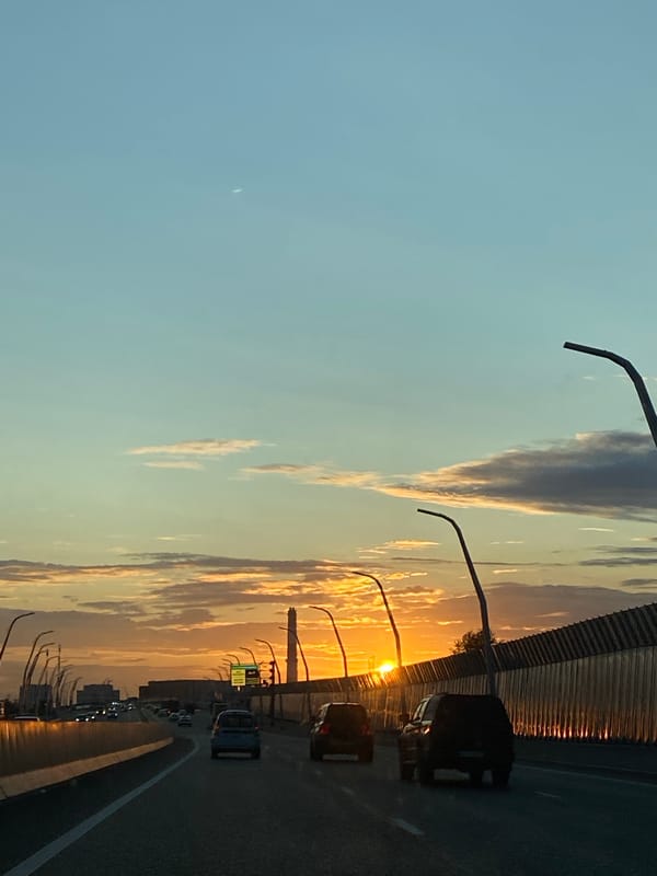 Crescent moon rises over Lyubertsy highway at dusk