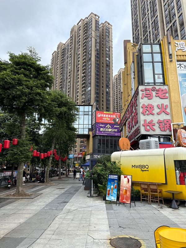 Haizhu District street strip with food vendors and outdoor dining