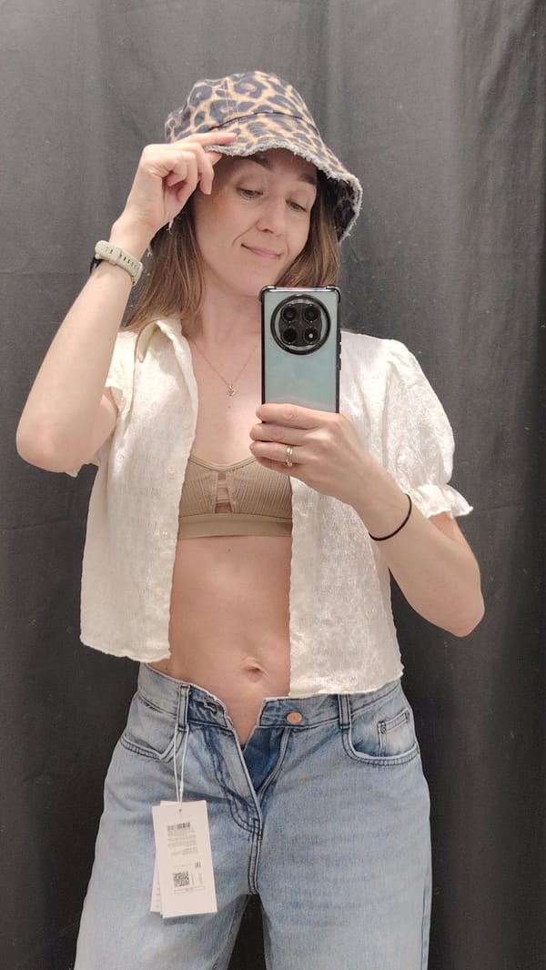 Woman takes mirror selfie in changing room