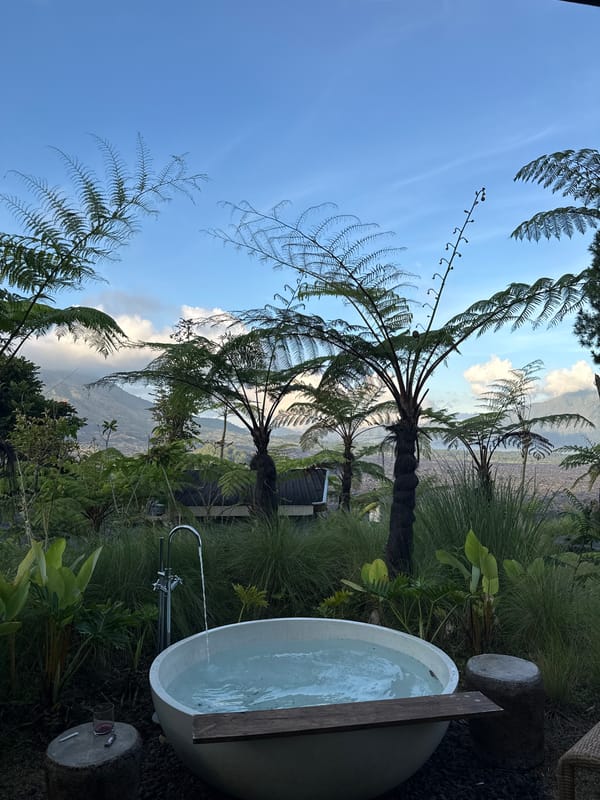 Tourist enjoys outdoor mountain bathing experience in Kintamani, Indonesia