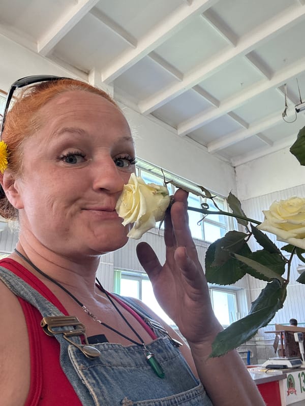 Woman poses with roses during early morning photoshoot in Chaikovsky