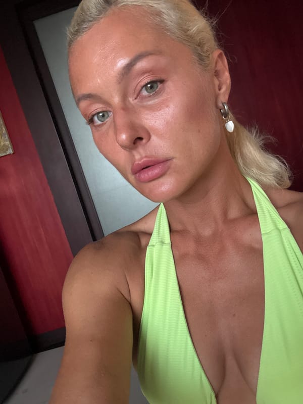 Outdoor close-up portrait with green eyes and blonde hair