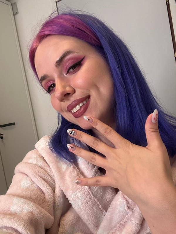 Woman showcases colorful nail art in Zagreb selfie session