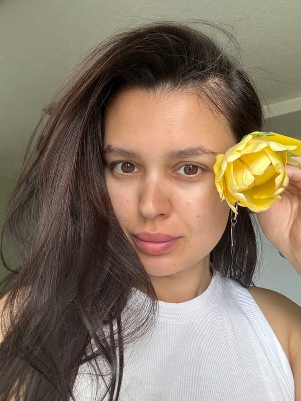 Woman poses with tulip, kittens filmed in Chaikovsky
