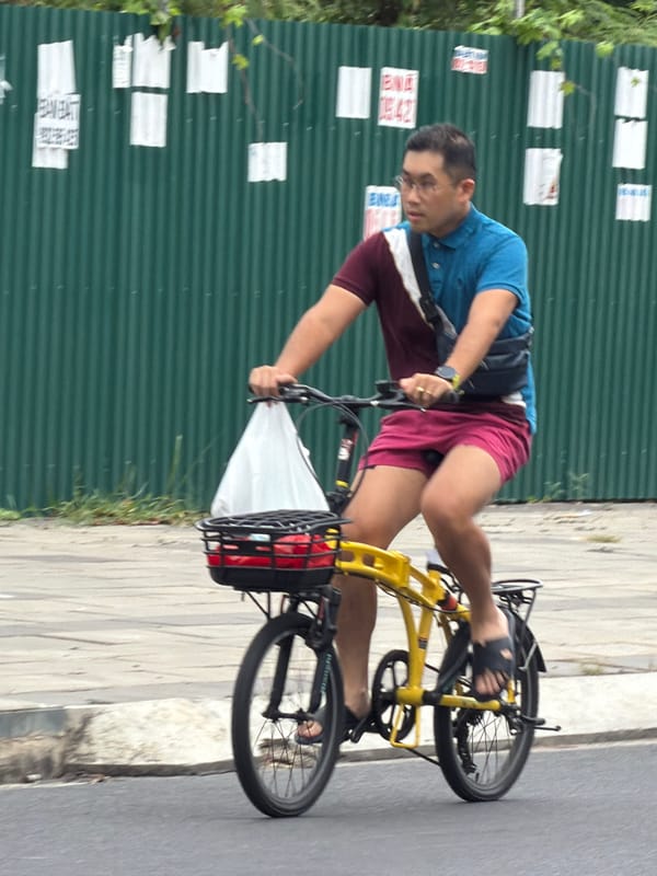 Morning traffic mix on a Nha Trang street, July 2026